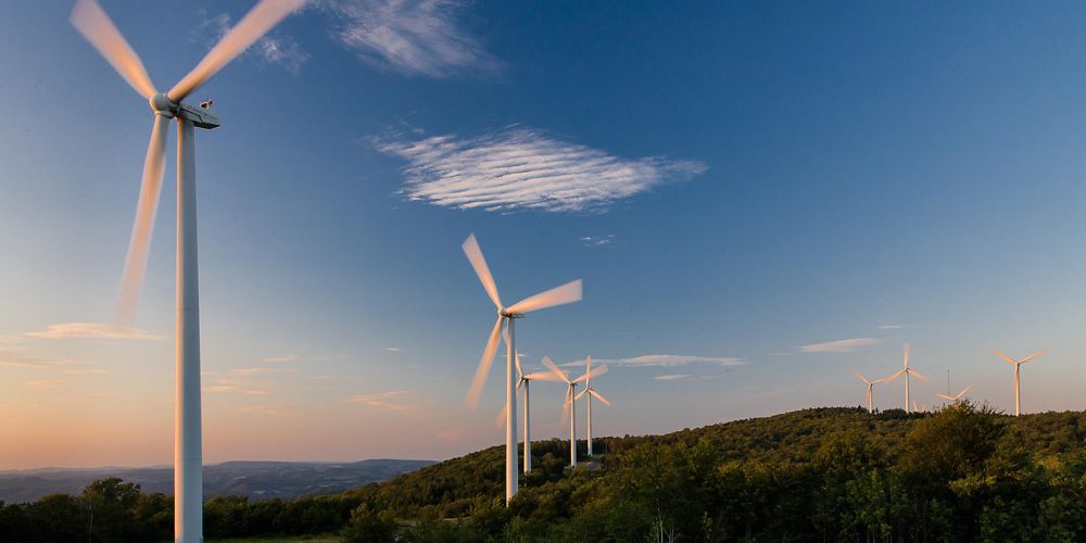 Wind farm turbines on a ridge top.